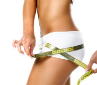 Woman measuring perfect shape of beautiful hips. Healthy lifestyles concept